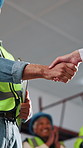 People, handshake and businessman with contractor in office with deal for renovation or repairs. Below, partnership and employee shaking hands with foreman for agreement on construction remodeling.