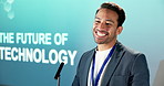 Happy, man and talk in conference with presentation, projector and speech for emerging AI technology. Person, smile and speaking in seminar with digital transformation, innovation and future of IT.