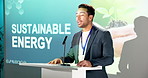 Businessman, presentation and talk in conference with projector, advice and sustainable energy tips. Keynote speaker, person and proposal in seminar with screen, eco friendly convention or discussion