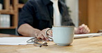 Businessman, hands and typing with coffee in office for productivity, energy or caffeine drink. Man, employee or research with computer, beverage or cup for business or productive day in workplace