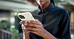 Texting, online and hands with phone in office, chat and communication with contact on social media. Typing, message and person with mobile, internet search and networking with technology in business