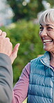 Senior, happy woman and high five at park for fitness goal, wellness target or retirement health. Laugh, pensioner or friend in celebration outdoor for exercise achievement, team effort or milestone