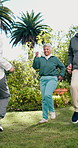 Senior, people and instructor at park for exercise class, functional fitness and marching in place. Happy, old group or coach with high knees outdoor for active aging, low impact movement or aerobics