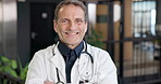 Face, man and doctor with smile, healthcare and wellness service at hospital with confidence. Medical integrity, happy portrait or mature person at lobby, about us and general practitioner with pride