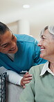 Nursing home, support and senior woman with nurse, retirement and discussion with patient in lounge. Assisted living, comfort and compassion for old person, happy and conversation with caregiver