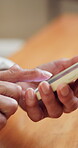 Hands, old woman and typing with phone in home for online puzzle, word search and memory test. Retirement, senior citizen and mobile app in apartment for playing game, web bingo and gambling site