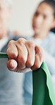Senior, hands or stretching with resistance band for physio, back massage or guided spasm relief. Clinic, worker or old person with equipment for physical therapy, assisted exercise or rehabilitation