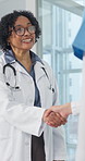 Happy woman, doctor and nurse shaking hands for healthcare agreement, shift handover or welcome. Smile, mature person and handshake with medical partner, greeting or talk of care transfer in hospital