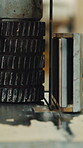 Carpentry, process and production with gear machine in workshop for furniture manufacturing. Equipment, hardware and industry machinery with band saw feeder in woodworking factory for lumber cutting