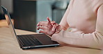 Woman, hands and laptop with wrist pain for injury, carpal tunnel syndrome or muscle tension. Female person, typing or sore arm with computer for joint inflammation, discomfort or strain on desk