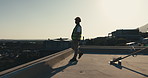 Thinking, construction and man on rooftop walking for inspection, property development and project. Architecture, engineering and person with helmet, thought and outdoor for infrastructure evaluation
