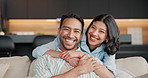 Face, couple and hug with laugh on sofa for bonding together, relationship joke and support. Love, happy people and embrace in home for affection, healthy marriage and funny conversation on weekend