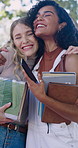 Smile, people and students at campus with hug, greeting and social interaction for education. Happy, friends and embrace outdoor with phone, acceptance and welcome classmate for learning at college