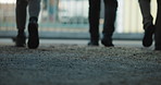Back, legs and people outdoor with warehouse, walking and inspection with teamwork for storage. Team, depot gate and quality assurance for supply chain, logistics and collaboration for production