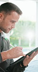 Remote work, tablet and man in lounge with pen, online writing and planning of brand identity. WFH, flare and graphic designer in home with stylus, creative insight and logo review in digital project