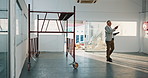 Inspection, walk or man on site with tablet, safety check or evaluation of building renovation. Checklist, review or mature engineer with tech, progress track or code compliance in remodeling project