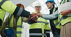 Happy, architect and team with hands together for building success, construction or mission. Low angle, people or group of contractors piling with stack, applause or smile for winning or celebration