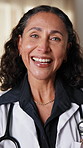 Face, doctor and healthcare with woman at hospital, medical professional and integrity with surgeon. Mature, physician or surgical specialist with ambition, pride and happiness for expert in medicine