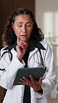 Thinking, doctor and woman with tablet in clinic with research, digital app for test results. Mature person, medical service or professional in hospital with tech, decision and healthcare schedule