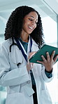 Doctor, scroll and happy woman with tablet in hospital, thinking and review test results on website. Clinic, medical professional and person with tech, laughing and research for treatment plan on app