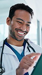 Doctor, laughing and man with tablet in clinic, smile and review test results on app and healthcare. Hospital, medical professional and happy person with tech, scroll and treatment plan on website