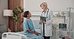Clinic, recovery and doctor with tablet, happy and explaining test results after surgery and health. Mature women, discussion and medical professional with tech, help and healthcare report on web
