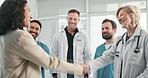 Team, doctor or businesswoman handshake in clinic for research grant, applause or offer acceptance. Laugh, donor and people shaking hands for support, celebration or health funding for vaccine trail