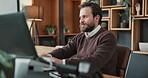 Smile, man and reading on computer in office for market timing, trade execution and profit alert. Research, trader and stocks review with tech for risk management, monitoring trends and economy news