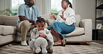 Daughter, parents and black child with fight in home for argument, conflict or divorce. Kid, stress and teddy bear with mom and dad in disagreement for break up, separation or living room dispute