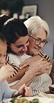 Happy woman, hug and bonding with senior mother in house, love and child with healthy food or lunch. Eating, meal and people with smile in dining room, family and embrace with old parent in home