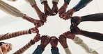 People, meeting and hands with fist bump in support group for social therapy, counseling or below. Low angle, community or huddle with circle or trust for unity, team building or solidarity together