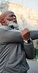 Fitness, senior and black man with outdoor stretching for workout preparation, exercise or training. Active, elderly or male person beginning with arm warm up for health or wellness in city street