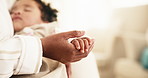 Love, mom and child holding hands in home for safety, parenting and support in living room. Care, mother and kid with bonding together at house for trust, development and guidance or security