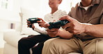 Gaming, hobby and hands of parent with child on living room sofa for bonding, competition or fun. Break, controller and video game with family in home together for learning, playing or teaching