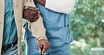Physiotherapist, hands and help man with cane for mobility exercise, balance and medical assistance. Healthcare worker, support and person with disability, walking stick or physical therapy in clinic