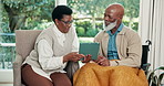 Tablet, talking and senior couple in home with discussion, connection and bonding with internet. Tech, woman and man with a disability for conversation, app or explain pension on retirement blog