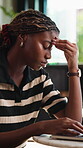Remote work, headache and woman with laptop in cafe, thinking and unhappy with design mistake on web. Freelance, graphic designer and black person with tech, migraine and bad news in coffee shop