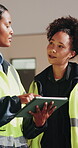 Construction, tablet or team on site with inspection, progress track or feedback on evaluation. Review, people or engineers with tech, quality control or partner assessment in building development.
