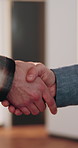 Blueprint, deal and construction team with handshake in office for building agreement or approval. Floor plan, welcome and civil engineer shaking hands with foreman for renovation contract on site.