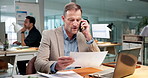 Laptop, man and phone call in office with paperwork, communication and accounting analysis chart. Tech, talk and mature person with financial document for tax evaluation, cost data and coworking