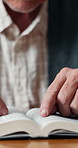 Hands, reading or senior man with book for knowledge, literature or story in retirement home. Elderly, male person or studying information with novel for wisdom, history or scripture in old age house