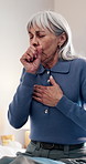 Sick, old woman and cough at house with discomfort, chest congestion and asthma symptoms. Unwell, senior person and airway irritation on bed with viral infection, bronchitis and breathing difficulty