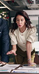 Talking, chart and woman with documents for finance review, investment and budget planning. Office, business and people with graph, paperwork and research for financial report, profit and growth