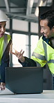 Engineer, team and happy people with laptop, talk or planning for project with blueprint in building. Civil engineering, supervisor and colleagues with technology, online and property development