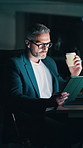 Night, coffee and business man on tablet for financial planning, audit and risk assessment. Office, corporate and mature person on tech for finance review, investment and caffeine for productivity