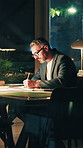 Architect, drawing and man with paperwork at night, overtime and drafting layout with tablet or info. Architecture, sketch and mature person with floor plan, working late or design deadline in office