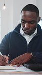 Architect, man and writing in office with notebook, plan and goal setting for property development. Black person, taking notes and reminder in business with diary, architecture summary and agenda.
