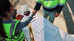 Handshake, blueprint and construction team outdoor with building, repairs or renovation deal. Floor plan, partnership and contractor shaking hands with civil engineer for negotiation on remodeling.