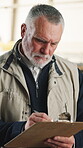 Carpentry, clipboard and mature man with planning, cut list update and bill of materials for order. Writing, carpenter and checklist in workshop for joinery details, production info or project notes