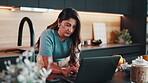 Woman, laptop and research in home for remote work, website or editing with productivity. Freelancer, pc and search online with feedback, proofreading and workflow for creative report in kitchen